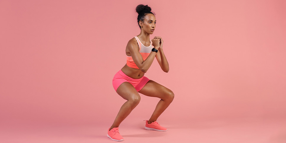 woman practicing squat exercise
