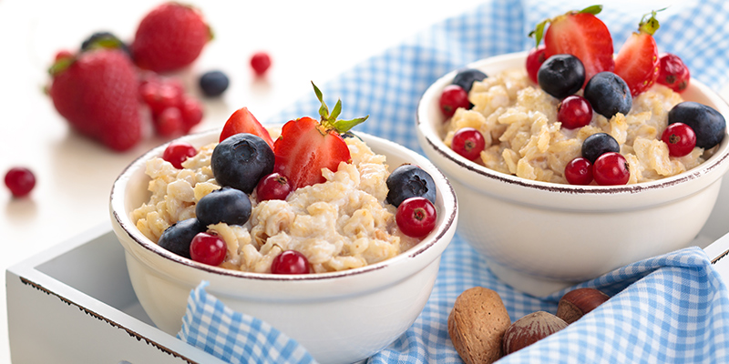 bowls of oatmeal with fresh fruit