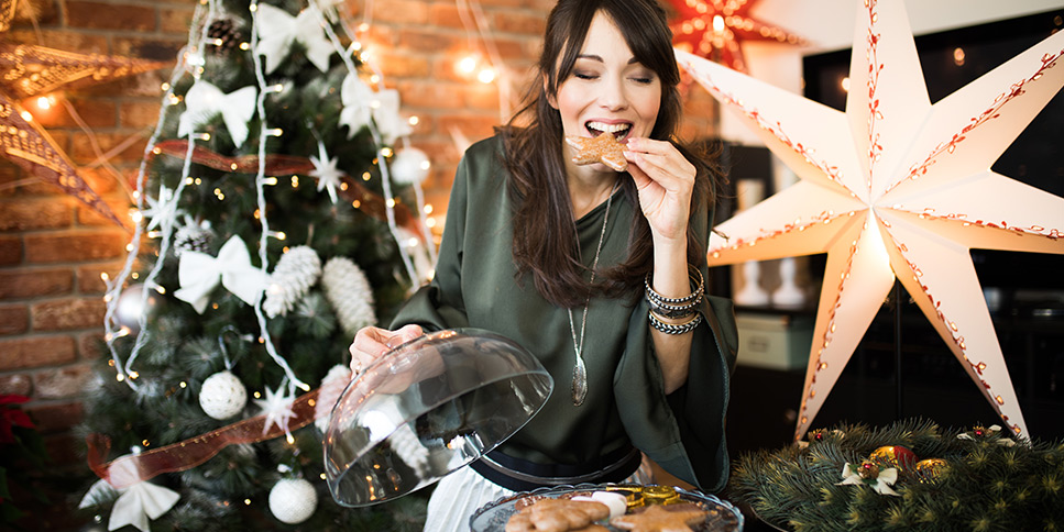 Woman enjoying a christmas cookie