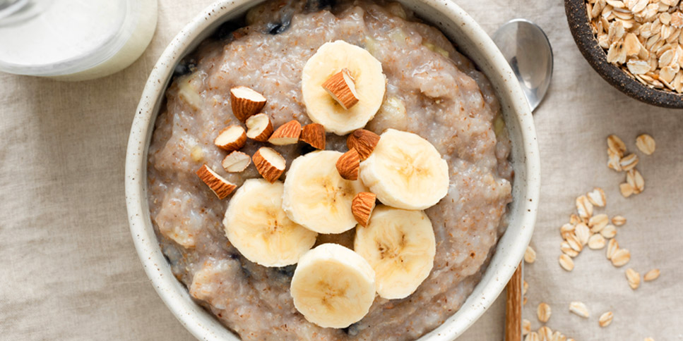 bowl of oatmeal with fruits and nuts