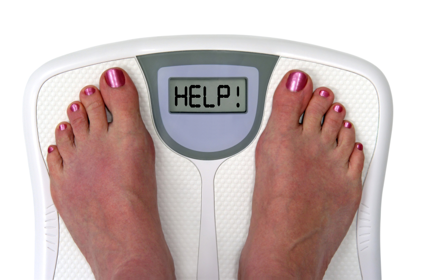 A digital weight scale with the word Help written across the display